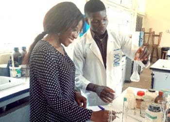 Stella Lohnap interviewing a science student in the laboratory at Nasarawa State University, Keffi in Nigeria.